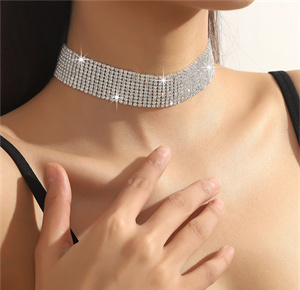 Broad rhinestone choker pictured at the neckline