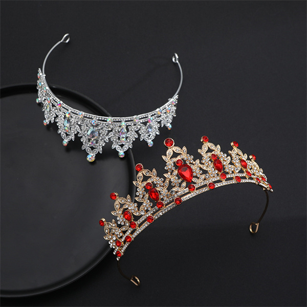 Crown and necklace arranged with red-appearing accent stones