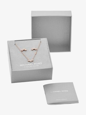 Jewelry gift box with a necklace and earrings arranged inside