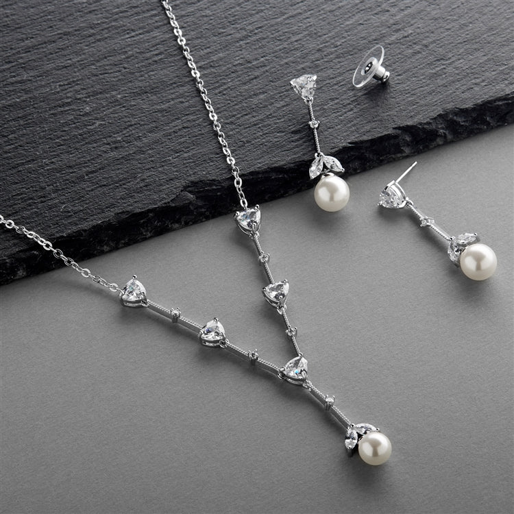Necklace and drop earrings with round accents shown together